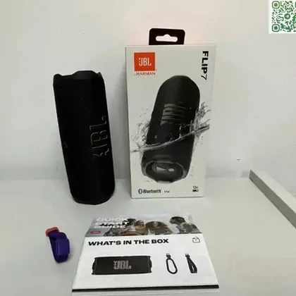 Portable black speaker, its box and included accessories