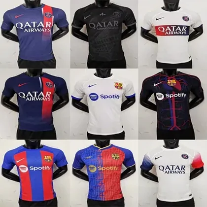 A selection of football shirts in different team colours